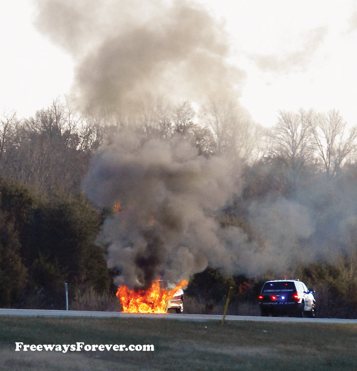 Car Burning on Highway Shoulder