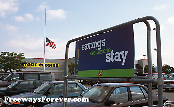 "Savings are here to stay" sign next to "Store Closing" sign
