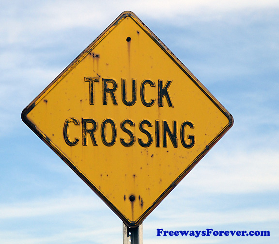 Truck Crossing sign with raised embossed letters