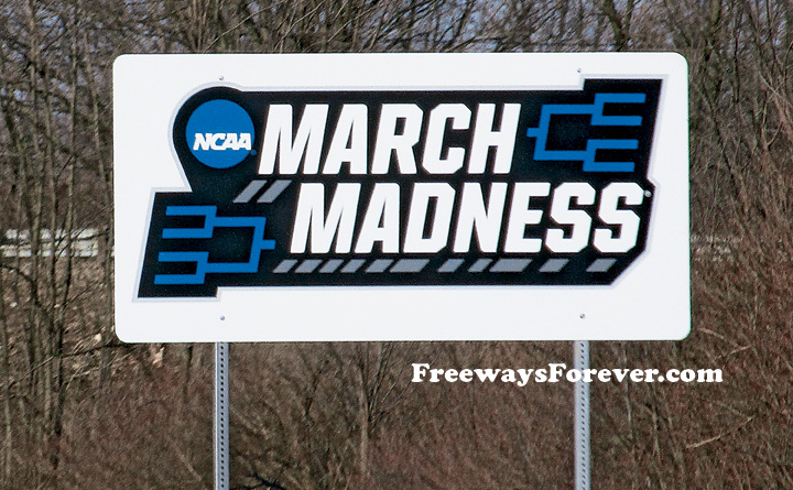 Hoosier Hoops NCAA March Madness college basketball tournament highway sign at Indianapolis, Indiana